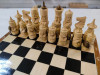 Шахматы резные ручной работы Богатыри в ларце 25 на 25 см фото 2 — hichess.ru - шахматы, нарды, настольные игры